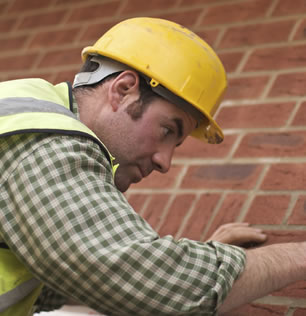 An image of an installer carrying out work on a house