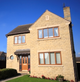 Modern brick house with timber windows on a sunny day