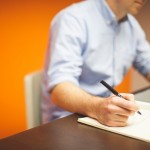 A sales manager making notes